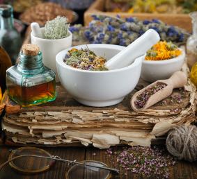 Herbs, spices, flowers, oils, mortar and pestle